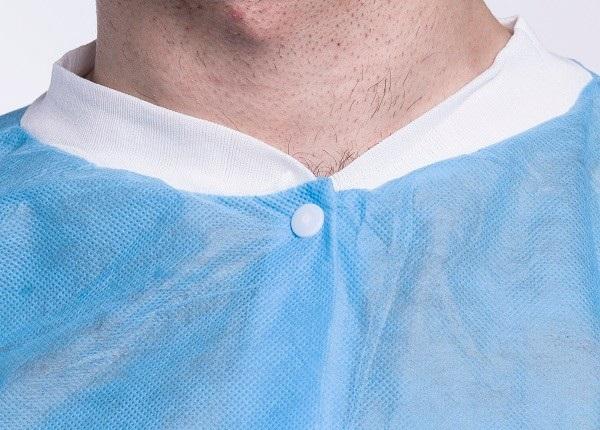 La professione d'infermiera non tessuta di alta qualitÃ  pp uniforma il breve cappotto del laboratorio
