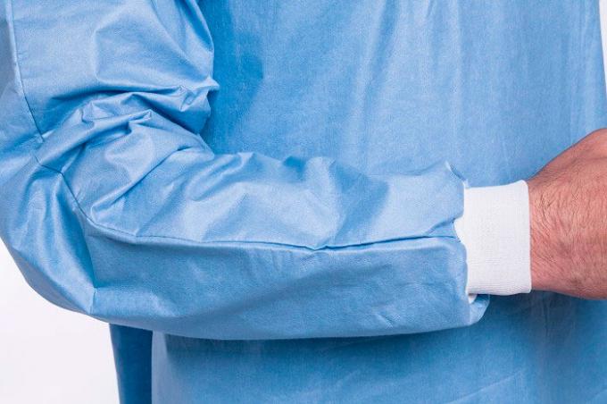 La professione d'infermiera non tessuta di alta qualitÃ  pp uniforma il breve cappotto del laboratorio